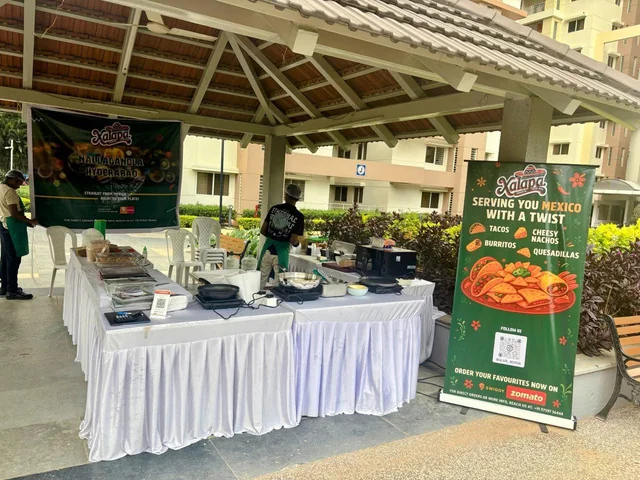 Xalapa counter spread with branded banner and standee
